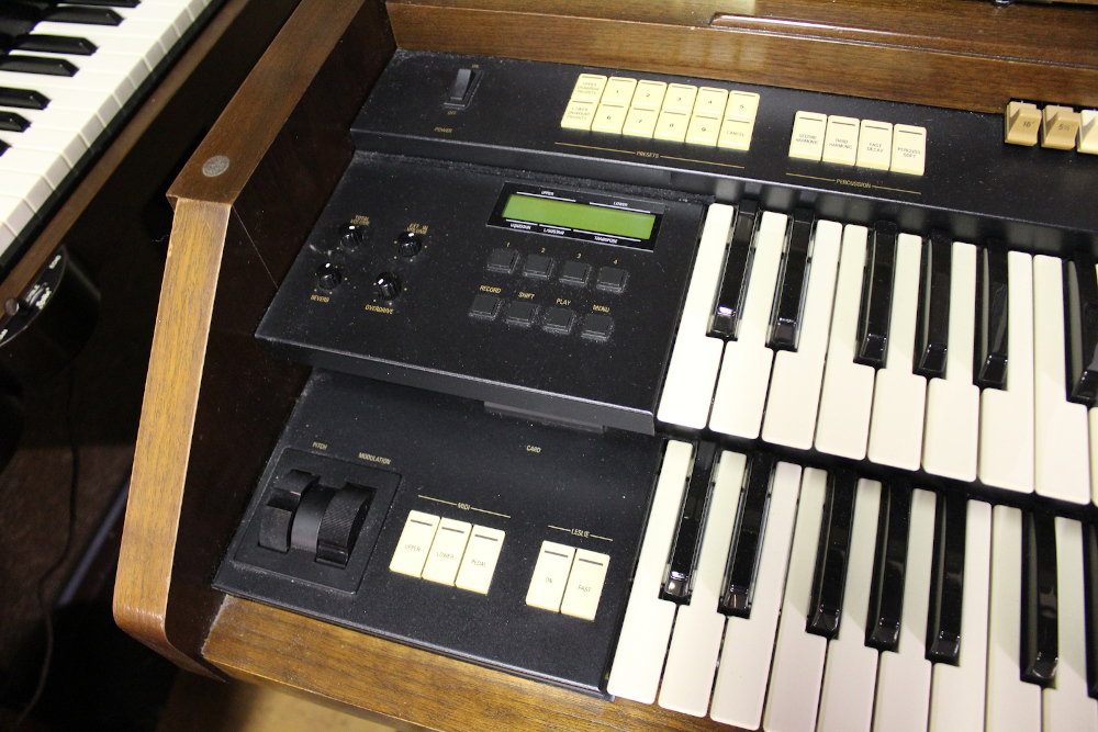 454 is a Hammond A-205 in a walnut finish equipped with a transposer, built-in speakers, and has an output for MIDI! Serial #01010285