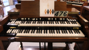 487 is a 1958 Hammond B3 for sale in a dark walnut finish.