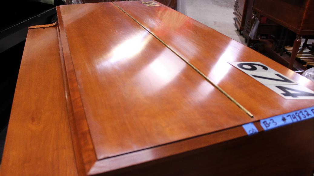 674 is a 1958 Hammond B3 in a fruitwood finish