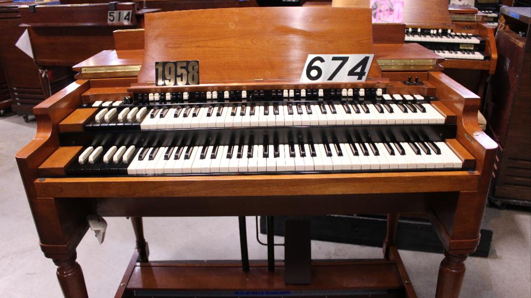 674 is a 1958 Hammond B3 in a fruitwood finish