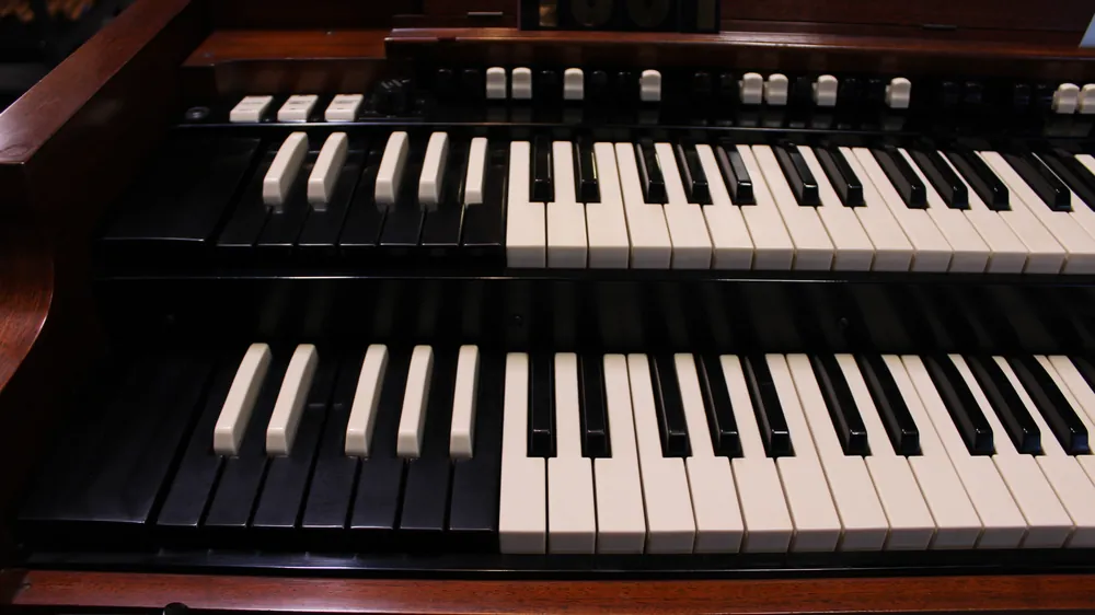 Angled view of keyboards and preset keys on 1963 Hammond B3 #693 in walnut finish